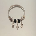 Gothic steel wire bracelet featuring skull charms, cross pendant and crown detail - Black Cross Skull Bracelet
