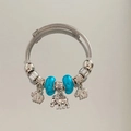 Detail of silver cable charm bracelet featuring blue beads and three elephant pendants - New Fashion Style (B1077-1)
