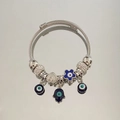 Detail of silver beaded bracelet featuring blue evil eye charms and Hand of Fatima pendant - White Zirconia All-Seeing Eye Bracelet