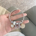 Silver woven steel bead bracelet featuring heart pearl charms and a bear pendant - Ocean Heart Bear Bracelet