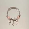 Silver charm bracelet with pink marble glass beads and heart-shaped key charms - Pink Heart Key Note Bracelet