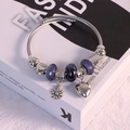 DIY stainless steel woven bracelet with purple glass beads and daisy heart charms - Black Sunflower Bracelet