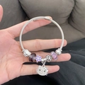 Silver twisted wire bracelet featuring purple glass beads and sparkling cat charm - Purple Five-Flower Cat Bracelet