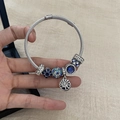 Silver twisted cable bracelet with blue rhinestone charms and star pendant on wrist - Bright Starry Moon Bracelet