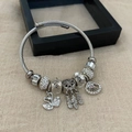 Silver beaded bracelet with swan and dreamcatcher charms on a steel cable chain - Swan Dream Dreamcatcher Bracelet