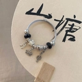 Silver twisted chain bracelet with music note and crown charms plus black faceted beads - Dreamy Starry Black Bracelet