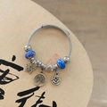 Silver twisted bangle with blue glass beads and romantic Valentine heart charms - Starry Blue Butterfly Tree of Life Bracelet