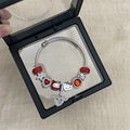 DIY charm bracelet with Hello Kitty pendants and red crystals in a black display box - New Year Red Double Cartoon Cat Bracelet
