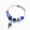 Elegante zilveren bedelarmband met blauwe emaille kralen en mooie oceaanhangers - Blauwe Haai Ballon