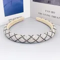 Padded rhinestone headband with black beads and beige velvet lining for a luxury look - Style A - White Base Black Rhinestone