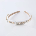 Elegant white padded headband with sparkling rhinestones and golden floral ornaments - White