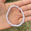 Detailed macro shot of white faux pearl beaded bracelet with elastic string for girls - 5MM Pure White Pearl Bracelet