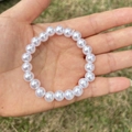 Detailed view of elastic faux pearl beaded bracelet for girls on a natural background - 8MM Pure White Pearl Bracelet