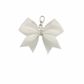 Detail of white satin bow keychain with sparkling rhinestone center and silver lobster clasp - White