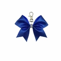 Detail of blue sequin bow keychain featuring a rhinestone center and silver lobster clasp - Blue