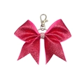Detail eines Glitzer-Schleifen-Schlüsselanhängers in Pink mit Strass-Mittelband - Rosa