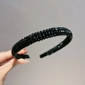Close-up of four-row black crystal headband with sparkling faceted beads and fabric edging - Black Crystal