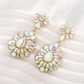Macro detail of teardrop floral earrings with AB iridescent crystals on gold base - AB Color