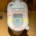 Pink and yellow cartoon dog paw print waterproof toilet seat cover with wavy edge - Checkered Pink Puppy