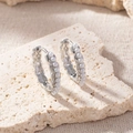 Elegant minimalist silver-toned hoop earrings adorned with delicate white pearls - Wavy Pearl Hoop