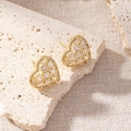 Elegant gold-plated heart-shaped stud earrings with sparkling cubic zirconia pavé. - Square Cut Heart