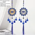 Hanging Evil Eye wind chime with metal rings blue bells and tassels in gold and silver - Gold And Silver Eye Disc Style (BF-805)
