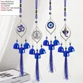 Blue Evil Eye wind chime with Om symbol, metallic frame and decorative tassels - Evil Eye Religious Om Ganesha Hanging Style (BF-303)