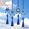 Blue Hamsa Hand and Evil Eye hanging ornament set with silk tassels against blue sky - Dark Blue Evil Eye Hamsa Tassel Style (YS-01A款)
