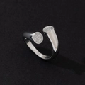 Detailed view of silver open ring featuring stone-paved circular ends on black surface - Minimalist Fashion Ring (L)