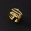 Detailed macro view of an elegant multi-layer gold-plated ring set with zircon stones - Minimalist Fashion Ring (M)