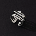 Macro view of a silver multi-layered ring featuring sparkling paved stones and single gem - Minimalist Fashion Ring (N)