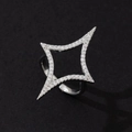 Detailed macro view of a silver four-pointed star ring with pavé-set stones - Minimalist Fashion Ring (T)