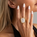 Retro gold statement ring with square white marble stone on model's hand - Light Gold + Marbled White (00986)