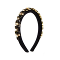 Close-up of a black padded headband with hand-set marquise and round crystals - Black