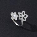 Detail of silver double flower ring with pearls and micro-pave diamonds on black background - Luxury Pearl (Style 9)