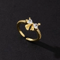 Detailed view of adjustable gold-plated ring with heart-shaped cubic zirconia butterfly - Niche Style (Style 14)