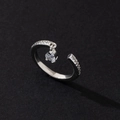 Macro detail of silver adjustable ring with pavé zircons and a heart crystal pendant - Elegant Style (Style 19)