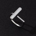 Macro view of adjustable ring featuring white mother of pearl inlay and pavé zircon stones - High-end Style (Style 21)