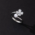 Elegant silver-toned four-leaf clover ring featuring sparkling zirconia and a white pearl - Commute Style (Style 29)