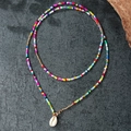 Bohemian colorful beaded necklace featuring a natural shell pendant and gold metal accents - Sx563 Rainbow Seashell Necklace