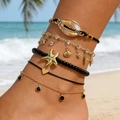 Juego de cinco tobilleras bohemias con estrellas de mar y conchas en una playa de arena - Juego de 5 Piezas con Tema de Océano Negro (31714-ank-black-EP)