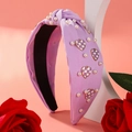 Lavender knotted headband with white pearls and checkered heart charms for women - Purple