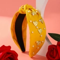 Fashionable yellow twisted headband with white pearls and heart checkerboard charm - Yellow