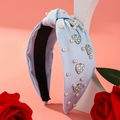 Light blue knotted headband with white pearls and checkered heart charms for women - Blue