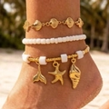 Bohemian meerlaags enkelbandje met gouden zeesterren en schelpjes op het strand - Multi-laags Oceaan Elementen Combinatie Stijl (31145-ank-G-EP)