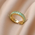 Detail of adjustable gold ring with baguette-cut light green stones on satin fabric - Pave Baguette Green Style (JZ4470G-4)