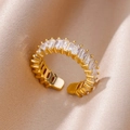Close-up of golden adjustable open ring with baguette-cut zircon on silk background - Pave Baguette White Style (JZ4470G-11)