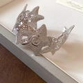 Detailed view of wide open cuff bracelet featuring interlocking starfish with textured relief - 3D Starfish (23# Eco-Silver)