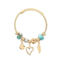 Golden cable charm bracelet with turquoise beads leaf and heart charms on white background - Blue