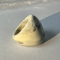 Detailed view of cream acrylic ring with marble texture and polished glossy finish - Beige(32358)